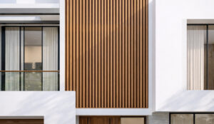 Luxury Mount Eliza home, with sleek white concrete lines and complimentary wood coloured aluminium batten wall panel, creating a bold, yet calming presence to the fascade of the home
