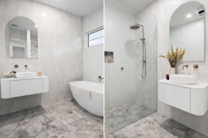 Elegant vanity with custom arch mirror, custom stone basin and open glass petitioned shower