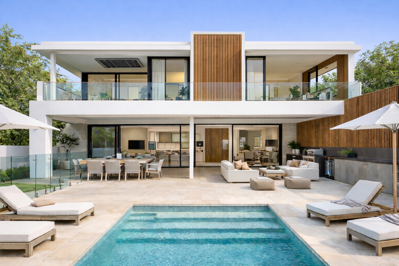 A holistic approach to exterior design, with contemporary, luxury exterior finishes, including pool tiles, balustrade, and aluminium battens