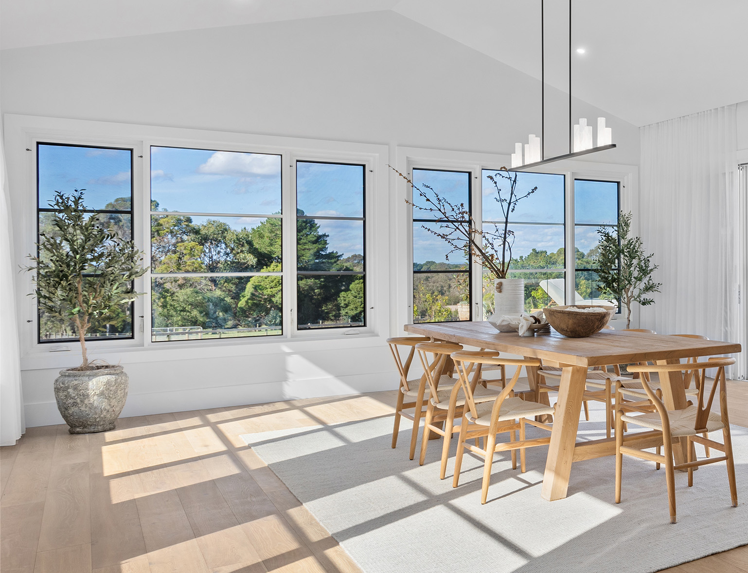 Light filled Hamptons living room, cased in premium steel windows