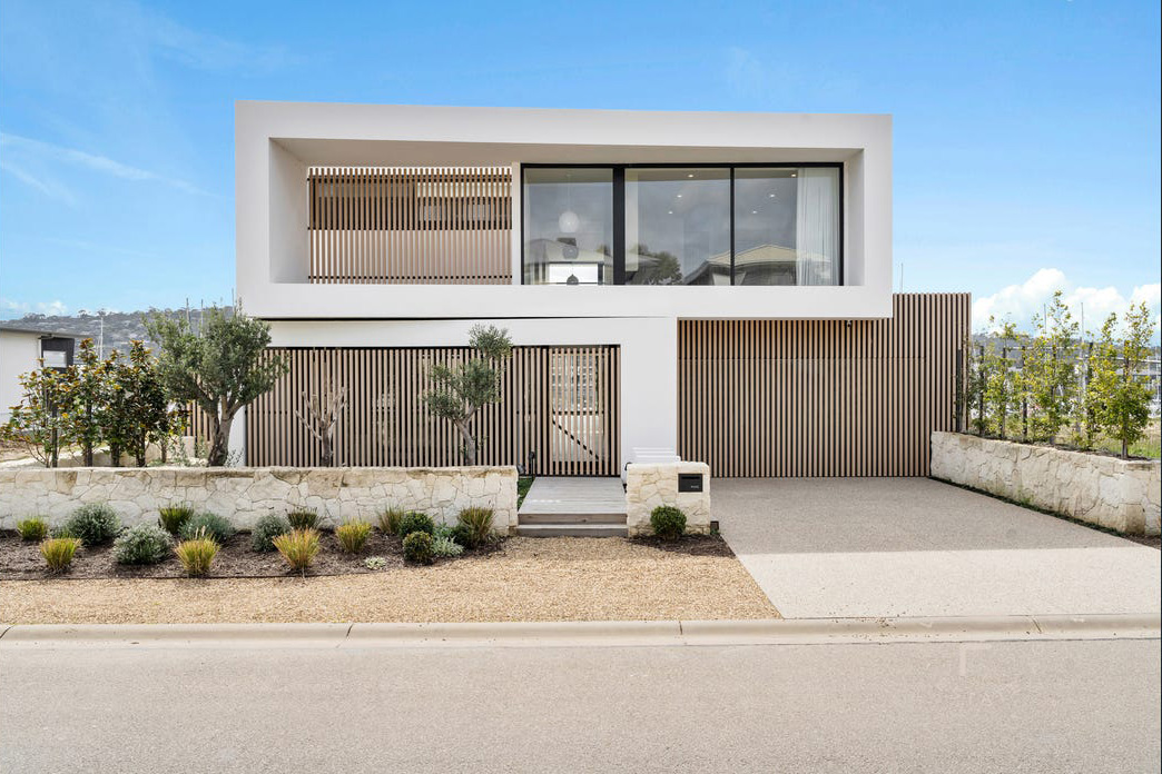 Modern architectural Marth Cove residence, backing onto the picturesque marina. Beautifully framed by aluminium battens, providing security, privacy and elegant vertical lines.