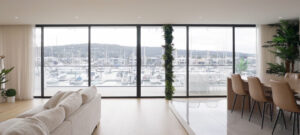 Beautiful black wall-to-wall steel windows perfectly framing the marina